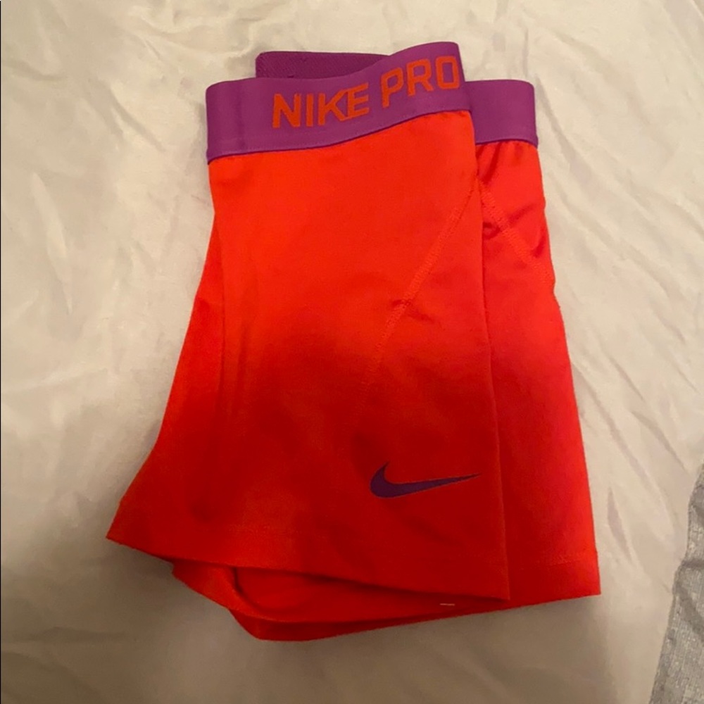 Red and purple Nike shorts